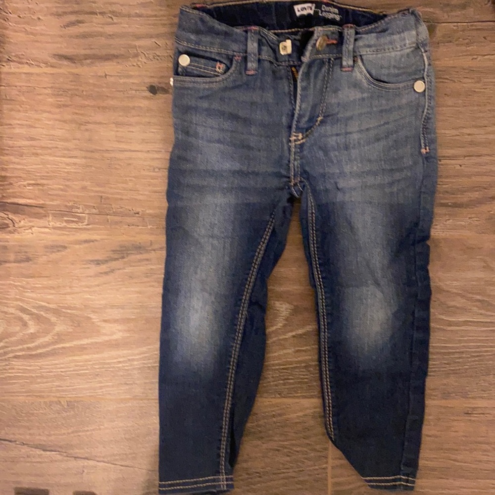 Levi toddler girl jeans with rhinestones on back pockets. 2T